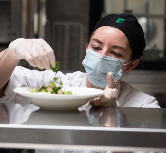 Student preparing a meal.